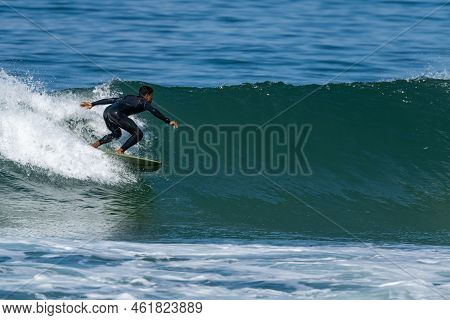Surfer Riding Waves