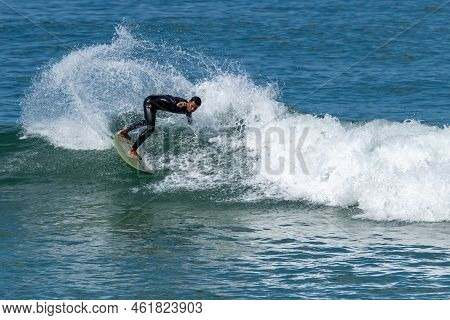 Surfer Riding Waves