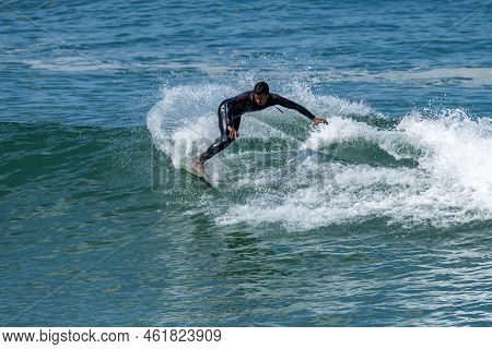 Surfer Riding Waves
