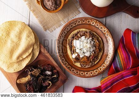Tostada De Tinga De Res. Typical Mexican Dish Prepared Mainly With Shredded Beef, Onion And Dried Ch