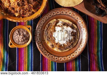 Tostada De Tinga De Res. Typical Mexican Dish Prepared Mainly With Shredded Beef, Onion And Dried Ch