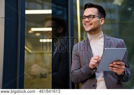 Successful Happy Business Man Working On Digital Tablet In Urban Background