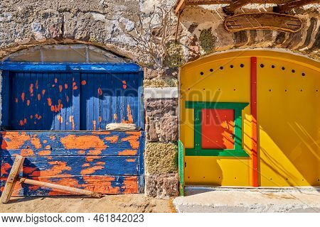 Colorful Blue And Yellow Boat Garage Doors, Klima Fishermen Village, Milos Island, Greece. Tradition