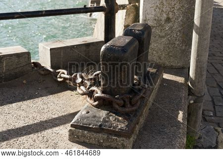 A Close Up View Of A Anchors Docking Station Up At The Side Of The Habour,