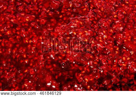 Raspberry Jam Background.raspberries In Sugar.the Texture Of Raspberry Jam.