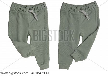 Children's Sportswear. Close-up Of A Green Kids Baby Sports Sweatpants In Two Views Isolated On Whit