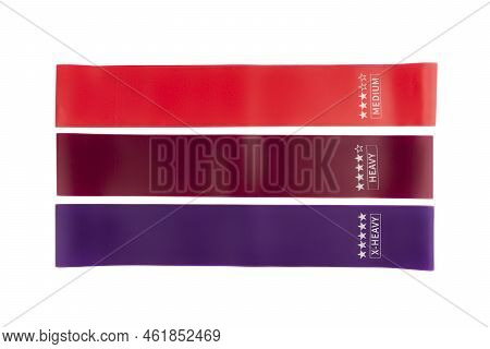 Fitness Elastic Band. Woman Showing A Blue Rubber Band. Sport And Healthy Active Lifestyle Concept. 