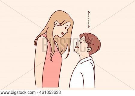 Couple With Different Height Look In Eyes. Tall Woman And Short Man Contrasting Height. Relationship