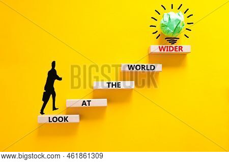 Look At The World Wider Symbol. Concept Words Look At The World Wider On Wooden Blocks On A Beautifu
