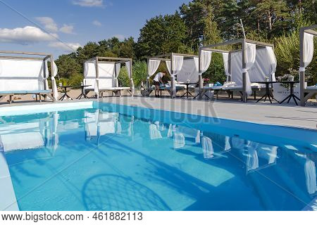 Latvia, Jurmala, August, 2022 - Gazebos For Relaxation Near The Swimming Pool On The Baltic Sea Beac