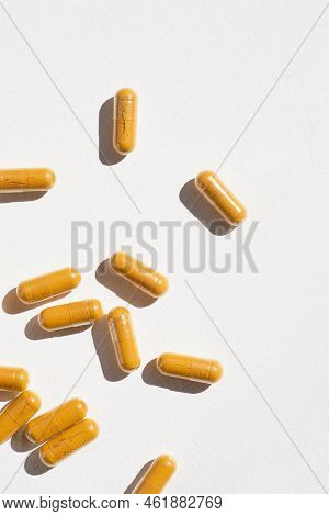 Turmeric Plus Black Pepper Extract Gelatin Capsule Close Up Top View. Herbal Supplement Organic Curc