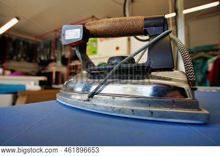 View Of Laudry From Inside With Tools, Washing Machine And Iron