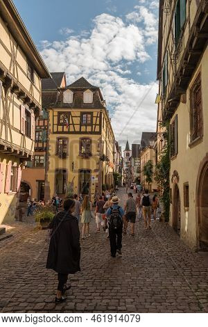 People On Street In Medieval Village Of Riquewihr, Alsace, France