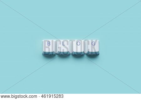 Word Blog Written On Computer Keyboard Keys Isolated On A Turquoise Background.