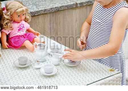 Little Preschool Girl Playing With Dolls. Happy Excited Child Play Tea Party With Toys. Role Games F