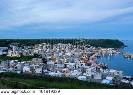 Penghu, Taiwan 27 June 2022: Xiyu township fishing village in Penghu of Taiwan at sunset