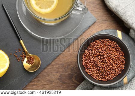 Buckwheat Tea And Granules On Wooden Table, Flat Lay