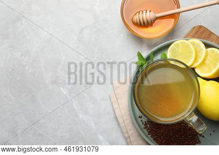 Buckwheat Tea, Lemon And Honey On Light Grey Marble Table, Flat Lay. Space For Text