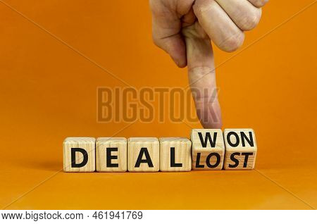 Deal Lost Or Won Symbol. Businessman Turns Wooden Cubes And Changes Words 'deal Lost' To 'deal Won'.
