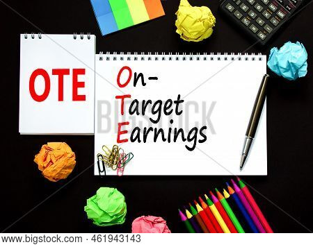 Ote On-target Earnings Symbol. Concept Words Ote On-target Earnings On White Note On A Beautiful Bla