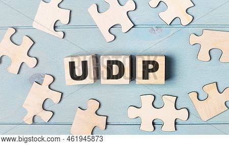 Blank Puzzles And Wooden Cubes With The Text Udp User Datagram Protocol Lie On A Light Blue Backgrou