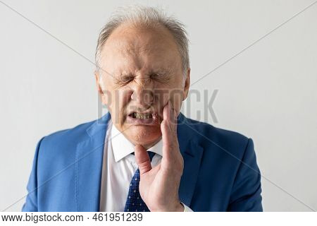 Close-up Of Mature Businessman Suffering From Toothache. Senior Manager Wearing Formalwear Wincing W