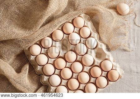 Fresh Organic Chicken Eggs In Carton Pack Or Egg Paper Container On A Sacking. Zero Waste Packaging 