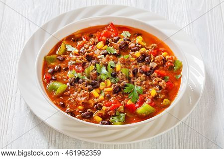 Taco Soup Of Ground Beef, Tomatoes, Chopped Green Chilis, Onions, Corn, Red Beans And Taco Seasoning