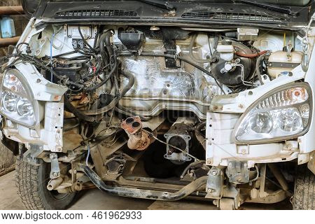 Engine Compartment Of A Van Car Without An Motor. Open Hood With Old Cars Details, Auto-waste.
