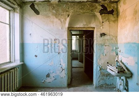 Wet And Moldy Wall In Room Of An Abandoned Soviet Hospital Building