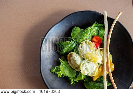 Breakfast In The Morning, Creamy Omelet And Buratta Chesese, Salad Avocado And Green Leaves On Black