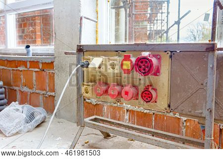 Distribution Panel With Industrial Multiphase Power Plugs And Sockets Are Providing Electrical Energ