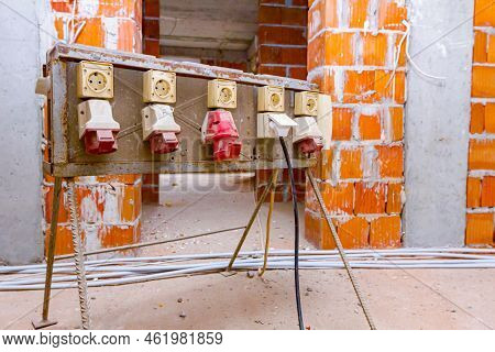 Distribution Panel With Industrial Multiphase Power Plugs And Sockets Are Providing Electrical Energ