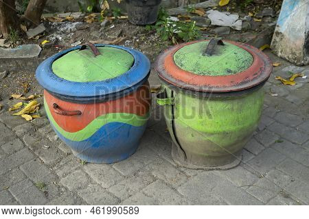 Two Colorful Trash Cans From Used Car Rubber Tires