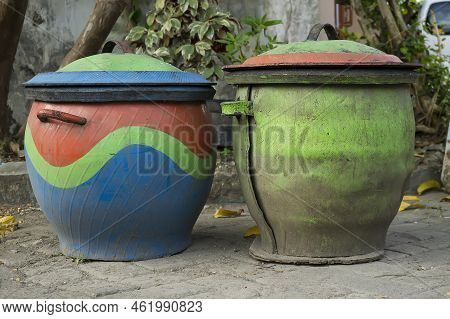Two Colorful Trash Cans From Used Car Rubber Tires