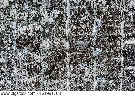 Dirty Old Eroded Cracked Plaster Cement Block Fence. Concrete Block Wall. Destroyed Crumbling Cement