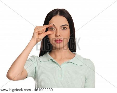 Woman Checking Her Health Condition On White Background. Yellow Eyes As Symptom Of Problems With Liv