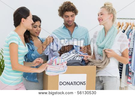 Group of young people with clothes donation