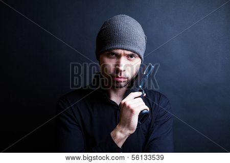 Portrait of a man holding gun
