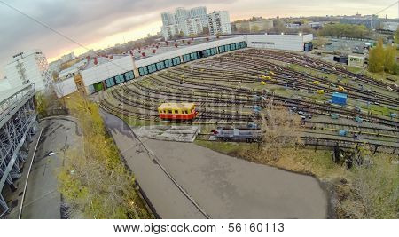 Yellow waggon near the gates of metro depot, view from unmanned quadrocopter.