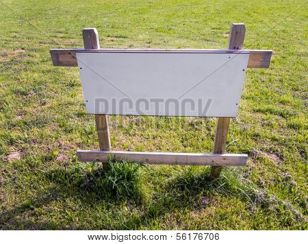 in a meadow there is a sign 