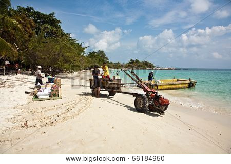 Beautiful Beach With Fine White Sand And Trees And Blue Sea In Romantic View And Blue Sky