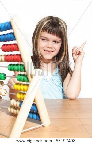 A young girl learning maths by using a sliding rule. All isolated on white background
