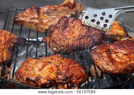 A nice grill barbecue with delicious marinaded meat.
