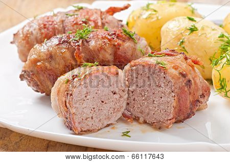 Grilled meat rolls wrapped in strips of bacon
