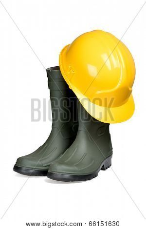 Protection helmet and rubber boots isolated over white with clipping path.