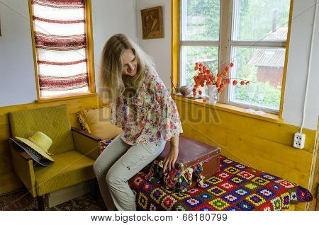 Young Woman Sitting Overstuffed Suitcase In Bed