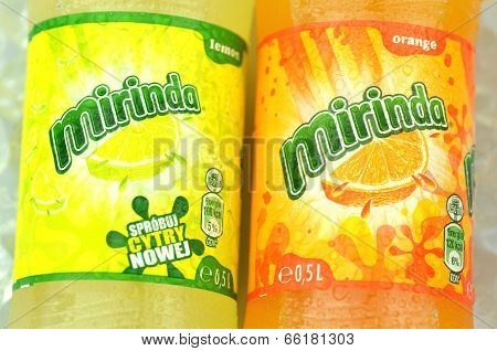 Bottle of Mirinda drink on ice cubes