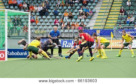 THE HAGUE, NETHERLANDS - JUNE 2: Chaos reigns as Spain vigorously defends a penalty corner by Australia during the World Cup Hockey, 