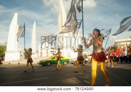 Actors Holding Flags In Harmony World Puppet Carnival In Bangkok,Thailand 2014 Parade.